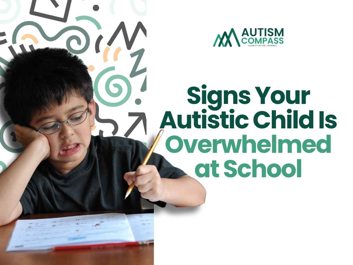 Young student wearing glasses looks frustrated while holding a pencil over an open workbook, representing school-related overwhelm. The Autism Compass logo appears beside the headline, “Signs Your Autistic Child Is Overwhelmed at School.” The image introduces a parent-focused guide to recognizing signs that an autistic child may be struggling with sensory, emotional, or academic demands at school.